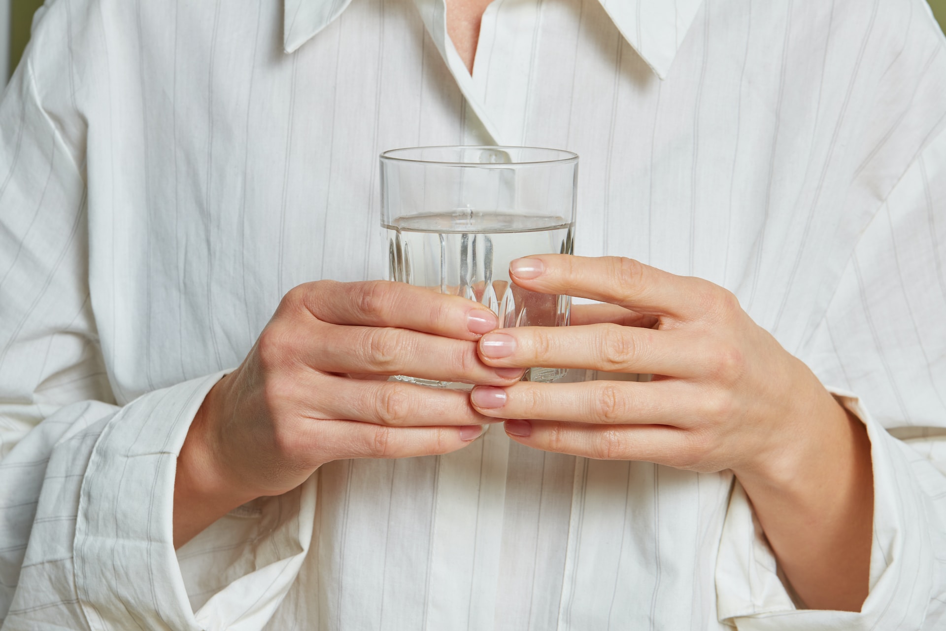 Dehydration, holding a glass of water